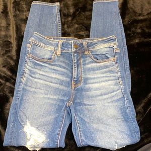 American eagle hi- rise jegging, medium blue, light distressing, size 6.